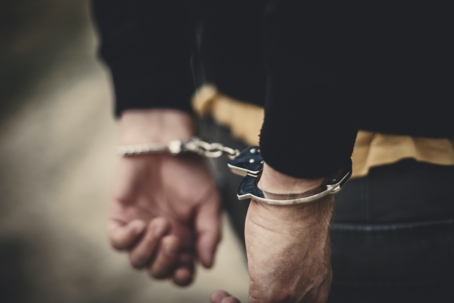 Human in handcuffs
